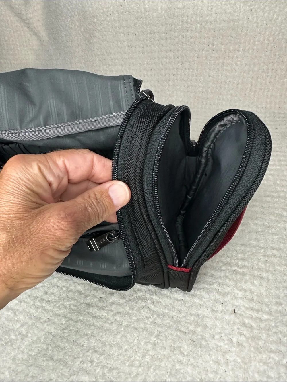 Tumi Black Toiletry Bag with Red Accents